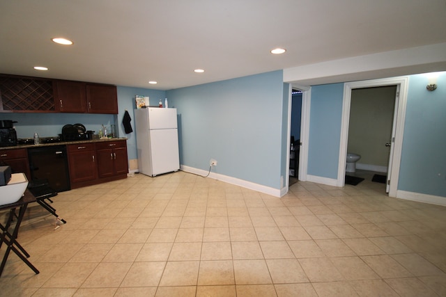 kitchen with light tile patterned floors, white refrigerator, and black dishwasher