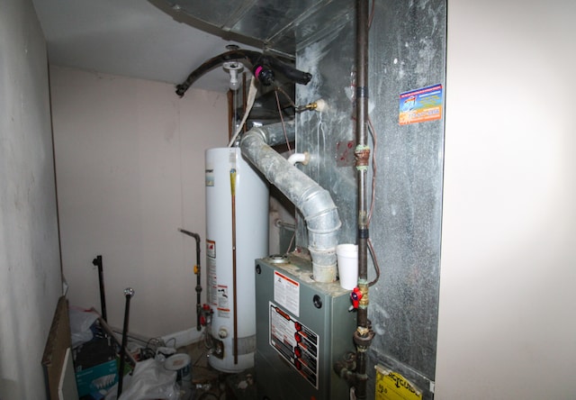 utility room featuring gas water heater