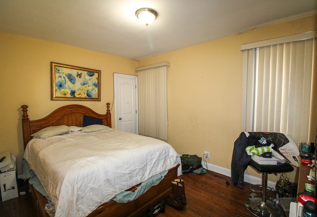 bedroom featuring dark wood-type flooring