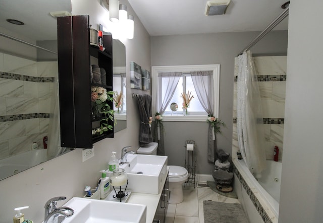 full bathroom featuring tile patterned floors, sink, toilet, and shower / tub combo