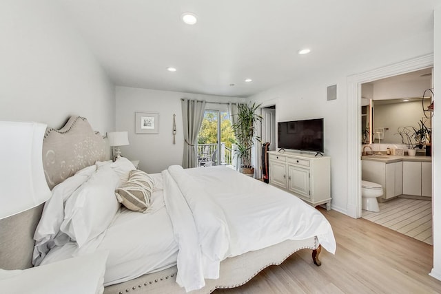 bedroom featuring access to exterior, light wood-type flooring, sink, and connected bathroom