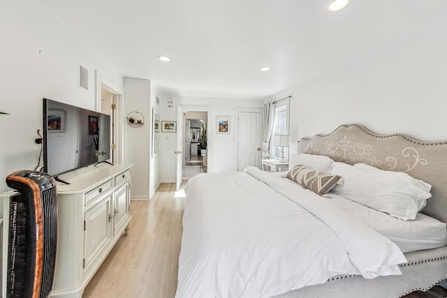 bedroom with light hardwood / wood-style floors