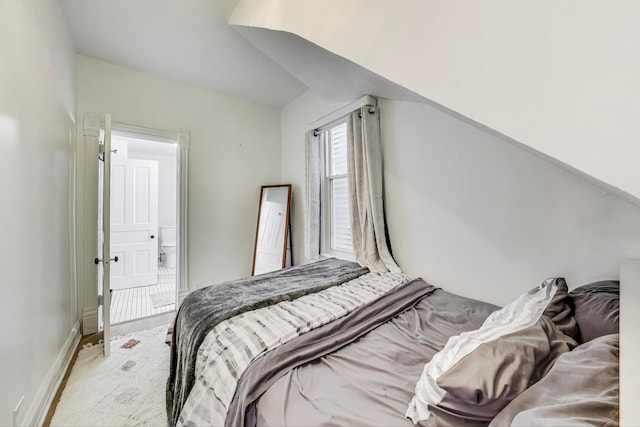 bedroom featuring light carpet