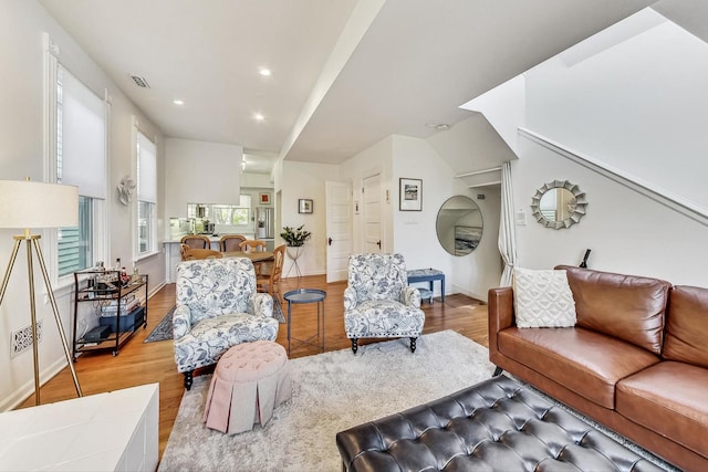 living room with light hardwood / wood-style flooring