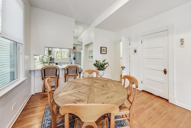 dining area with light hardwood / wood-style floors