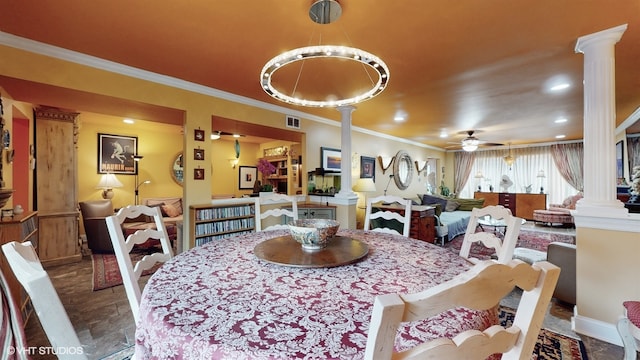 dining space with ornamental molding and ceiling fan with notable chandelier