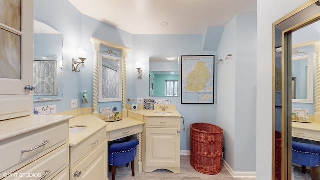 bathroom featuring an enclosed shower and vanity