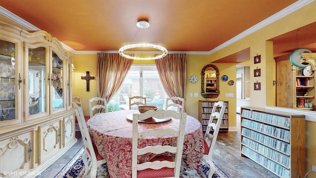 dining space featuring an inviting chandelier and crown molding