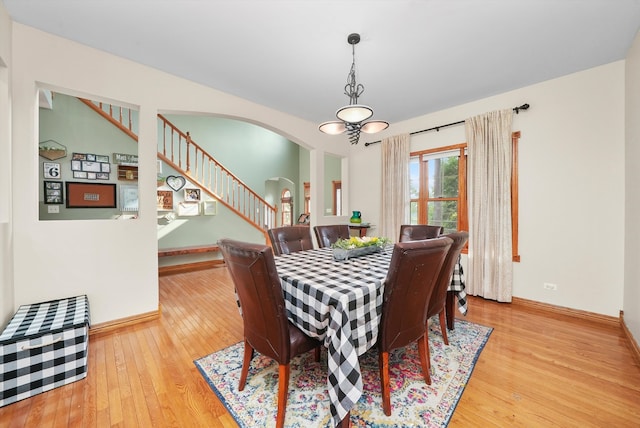 dining space with hardwood / wood-style floors