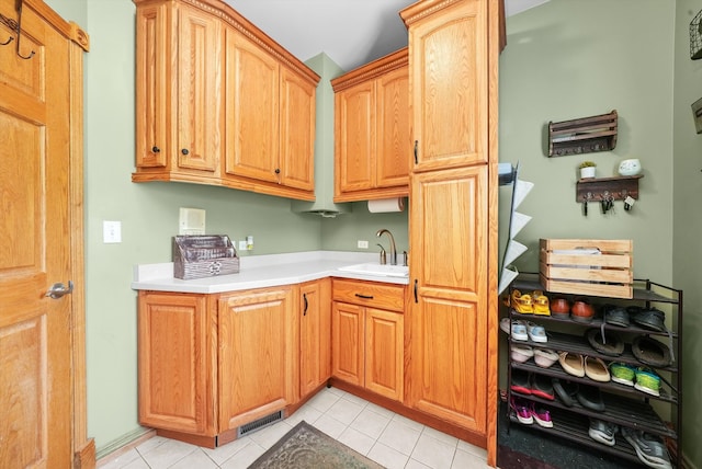 kitchen with sink and light tile patterned floors