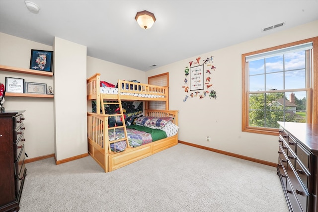 bedroom featuring light carpet