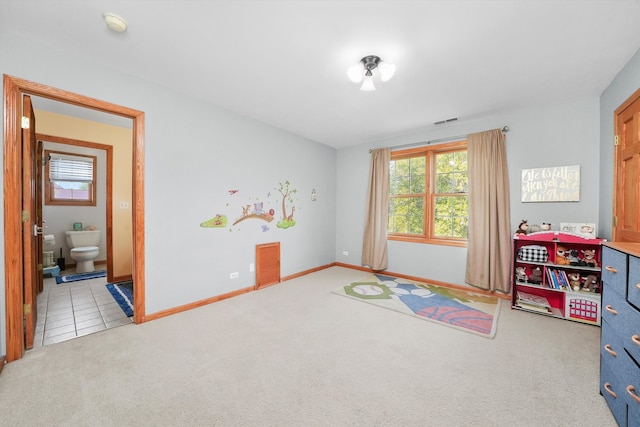 recreation room with light carpet