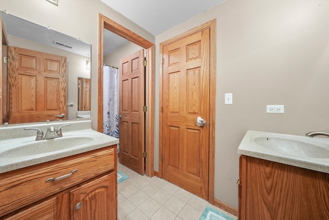 bathroom with vanity and tile patterned floors