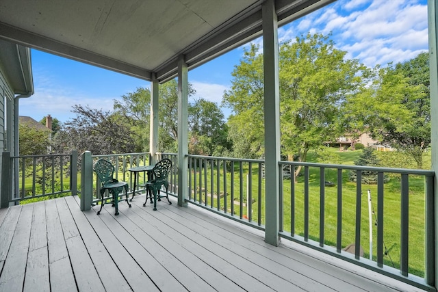 wooden deck with a yard