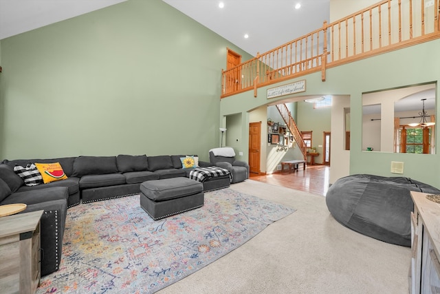 living room featuring high vaulted ceiling and hardwood / wood-style floors