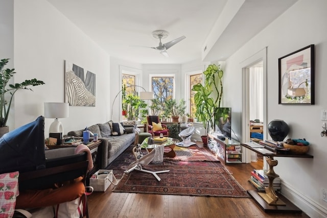 interior space with ceiling fan