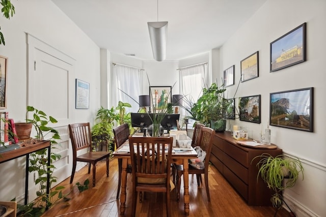 dining space with dark hardwood / wood-style floors