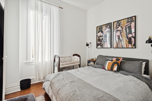 bedroom featuring hardwood / wood-style flooring