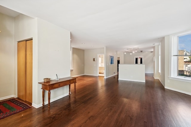 unfurnished living room featuring dark hardwood / wood-style floors