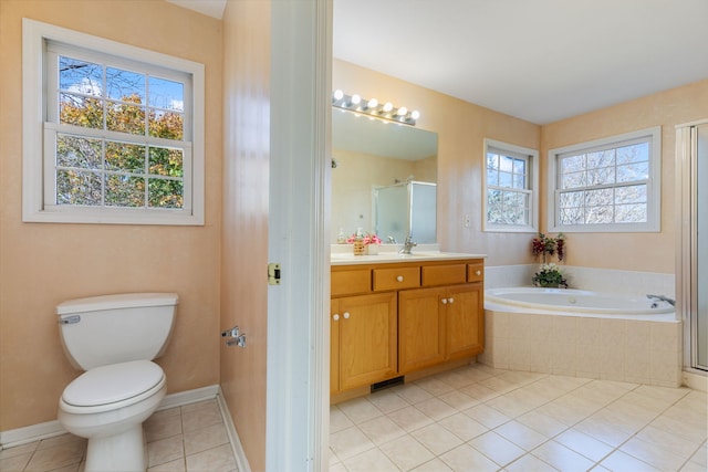 full bathroom with tile patterned flooring, vanity, toilet, and plenty of natural light