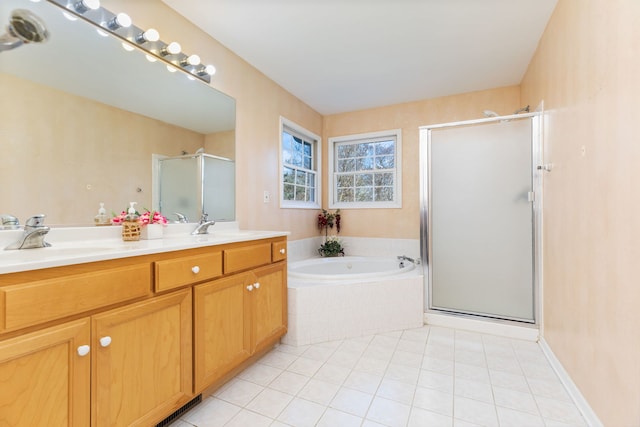 bathroom featuring tile patterned flooring, shower with separate bathtub, and vanity