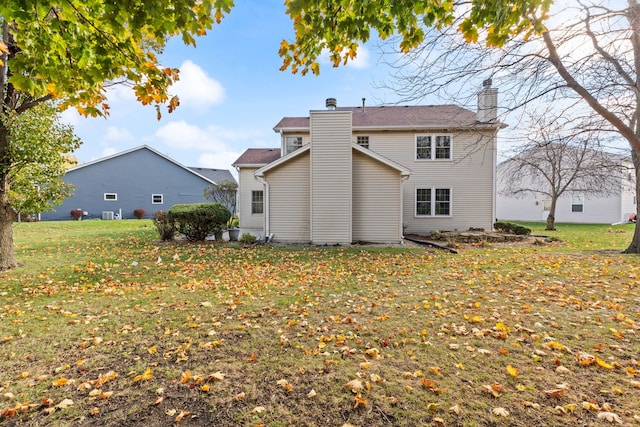 back of house with a yard