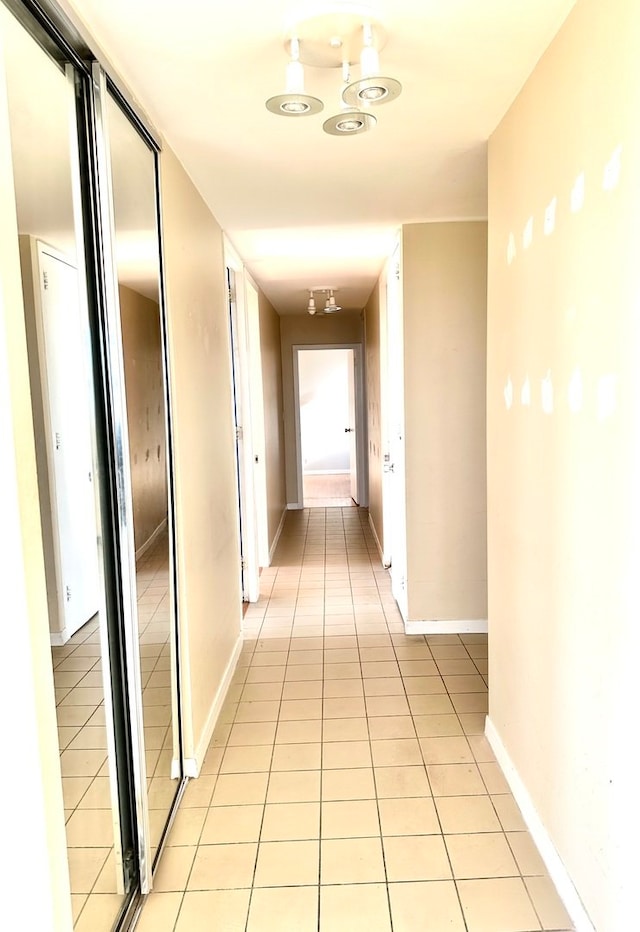 hallway featuring light tile patterned floors