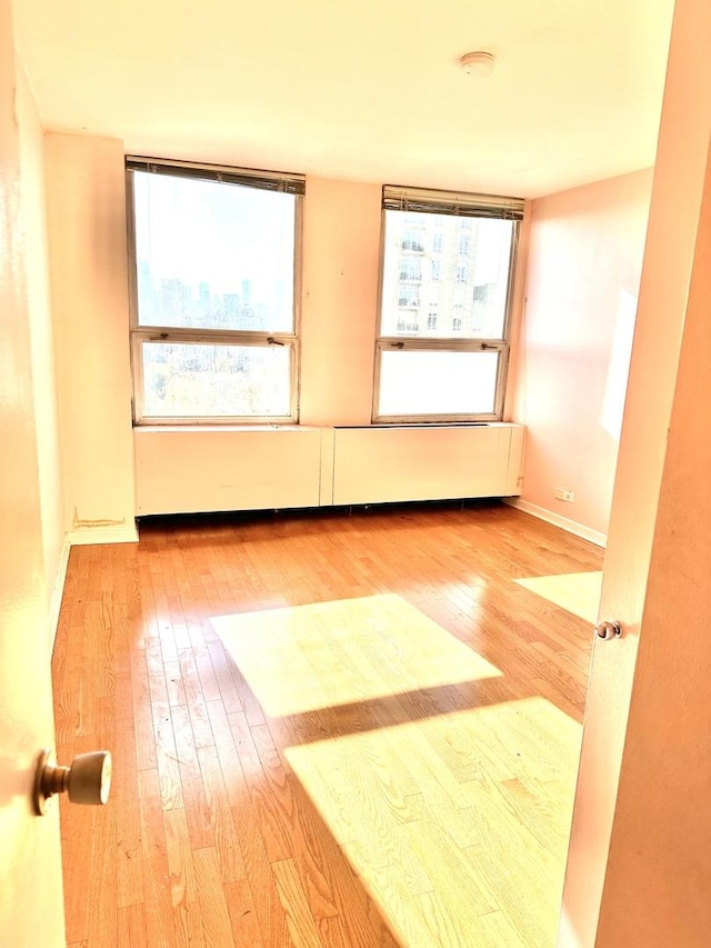 2626 N Lakeview Ave Unit 1503, Chicago, IL 60614 - spare room featuring hardwood / wood-style flooring, a smoke detector, healthy amount of natural light, and baseboards