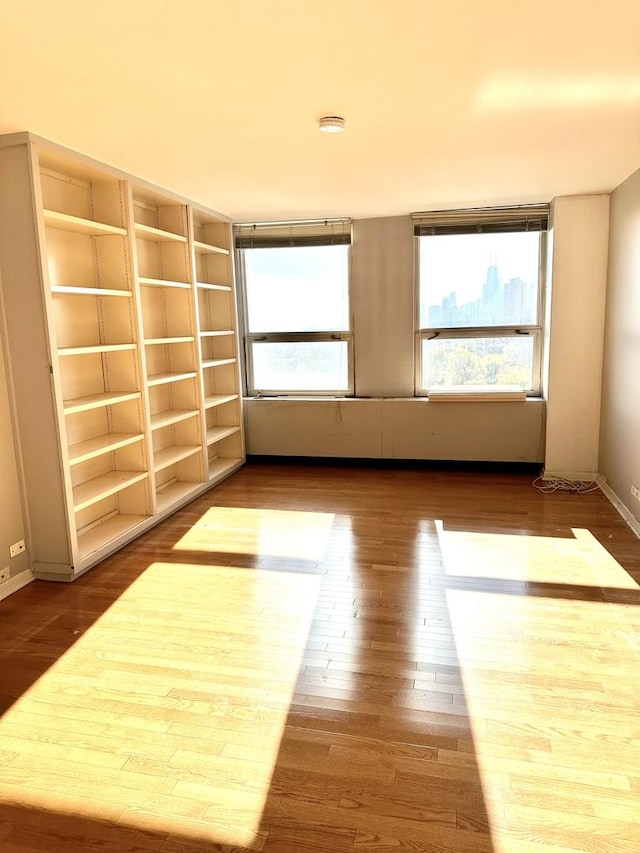 2626 N Lakeview Ave Unit 1503, Chicago, IL 60614 - unfurnished room with wood finished floors, baseboards, and a smoke detector
