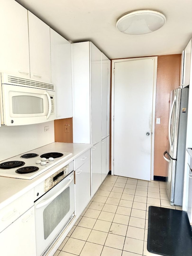 2626 N Lakeview Ave Unit 1503, Chicago, IL 60614 - kitchen featuring white appliances, white cabinets, and light countertops