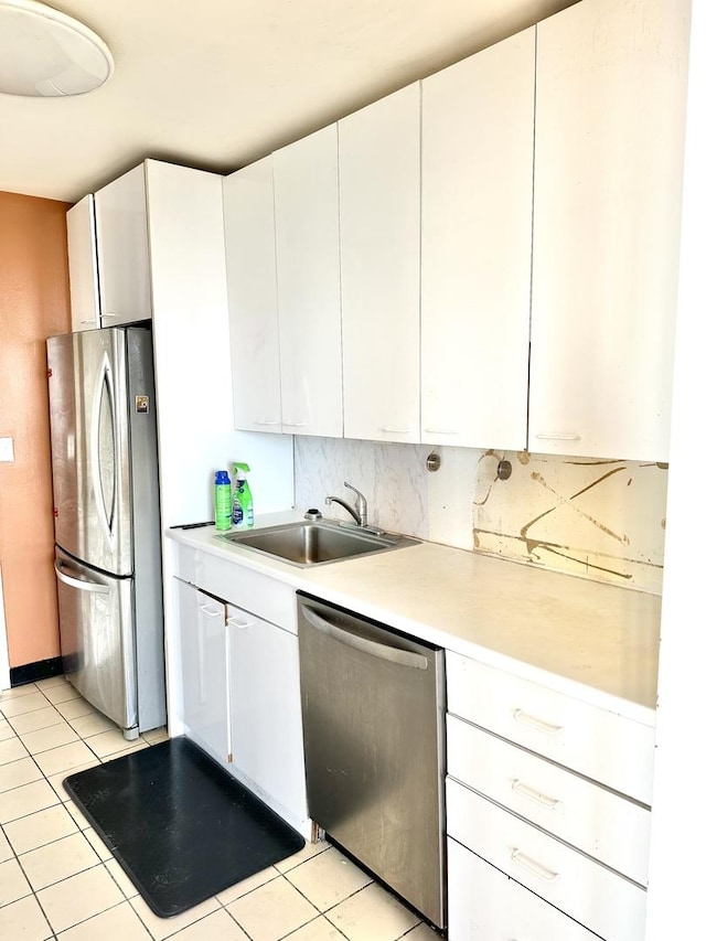 2626 N Lakeview Ave Unit 1503, Chicago, IL 60614 - kitchen with stainless steel appliances, a sink, light countertops, and white cabinets