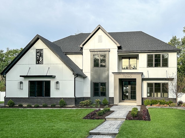 modern farmhouse with a front lawn