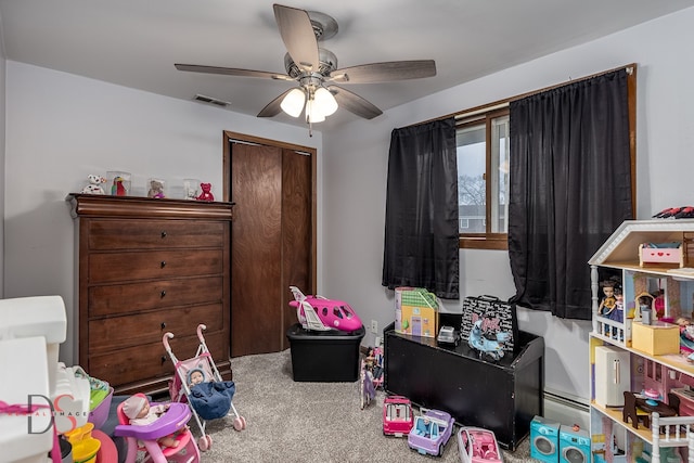 rec room featuring ceiling fan and carpet