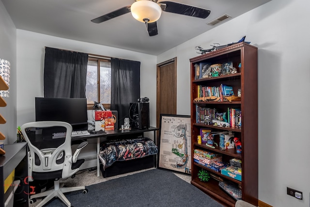 carpeted home office with ceiling fan