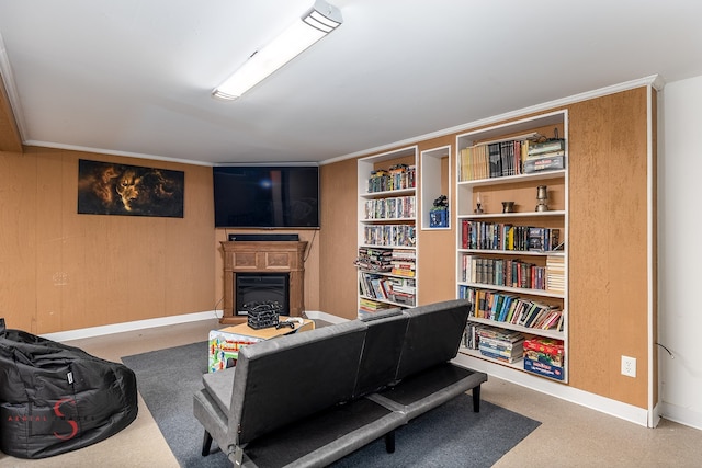 living room featuring wooden walls and ornamental molding