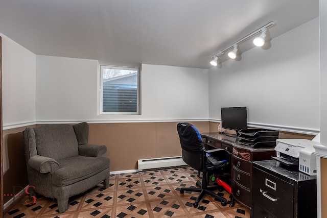 home office with a baseboard radiator and rail lighting