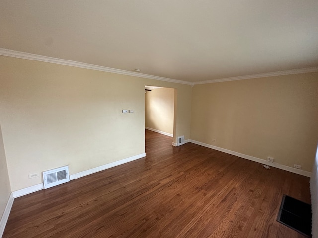 unfurnished room with dark hardwood / wood-style floors and crown molding