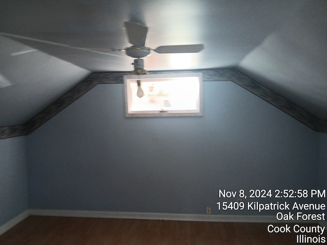 additional living space featuring ceiling fan, vaulted ceiling, and hardwood / wood-style flooring