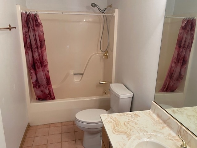 full bathroom featuring shower / bath combo with shower curtain, tile patterned flooring, vanity, and toilet