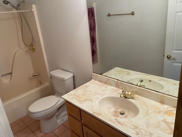 full bathroom with tile patterned flooring, vanity,  shower combination, and toilet