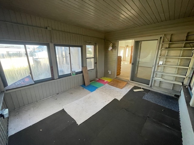 unfurnished sunroom with a wealth of natural light