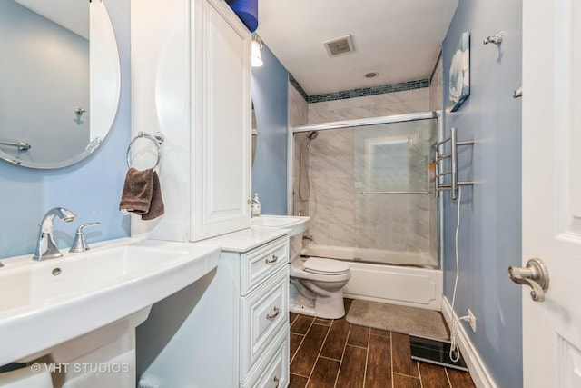 980 Brush Hill Ln, Lake Zurich, IL 60047 - full bath with a sink, toilet, bath / shower combo with glass door, and wood finish floors