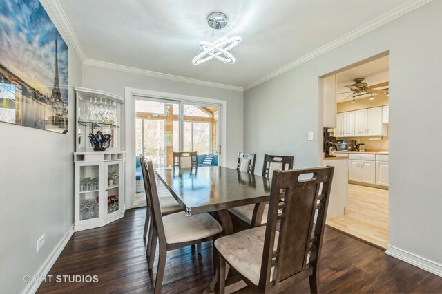 980 Brush Hill Ln, Lake Zurich, IL 60047 - dining room with a chandelier, crown molding, dark wood finished floors, and baseboards