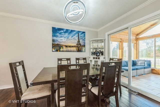 980 Brush Hill Ln, Lake Zurich, IL 60047 - dining room featuring wood finished floors, crown molding, and a chandelier