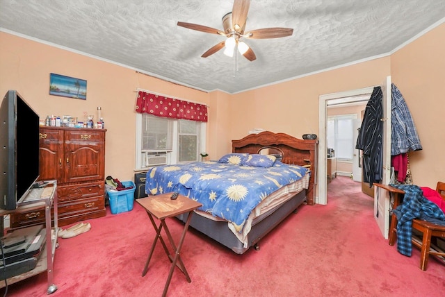 carpeted bedroom featuring a textured ceiling, cooling unit, ceiling fan, and ornamental molding