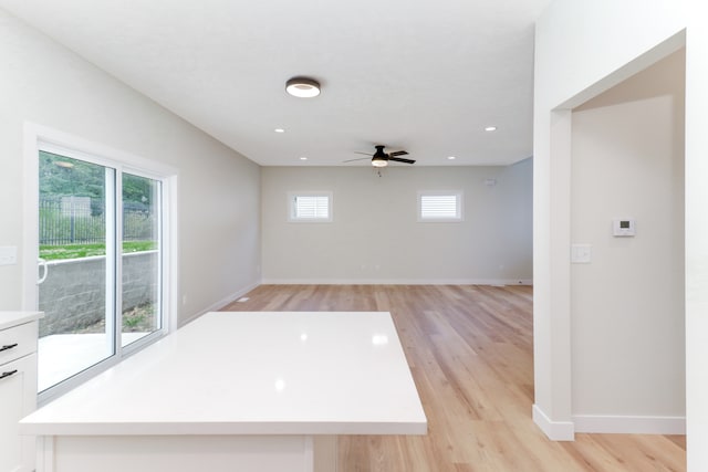 spare room featuring ceiling fan and light hardwood / wood-style flooring