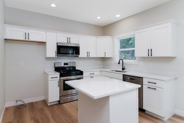 kitchen featuring white cabinetry, appliances with stainless steel finishes, and sink