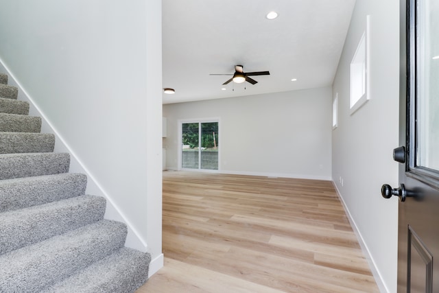 foyer entrance featuring light wood-type flooring and ceiling fan