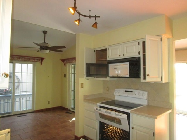 kitchen with white cabinets, white appliances, ceiling fan, and tasteful backsplash