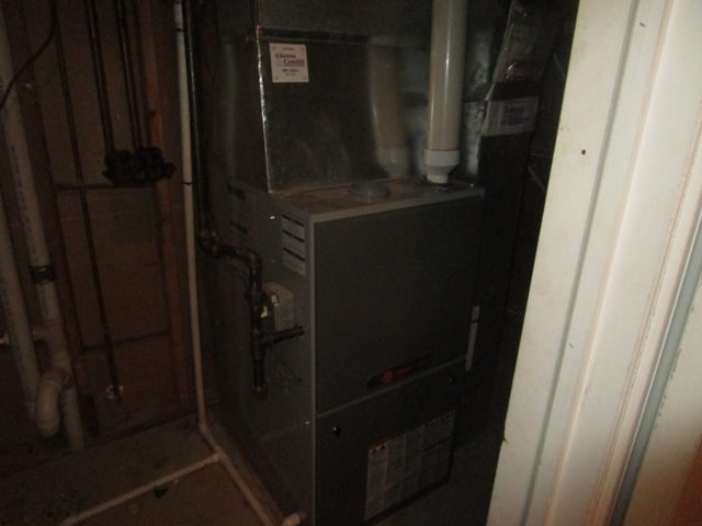 utility room with heating unit